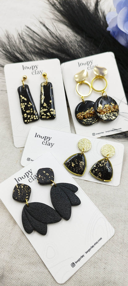 Orecchini pendenti oro e nero, tocchi luminosi